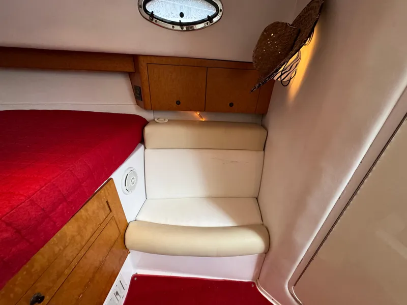 Slide: The Image of Interior cabin of a 2008 Donzi 38 ZSF boat with red bedding. - 29