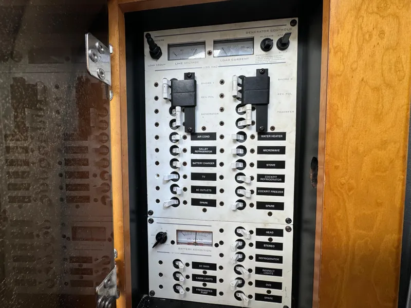 Slide: The Image of Electrical control panel of a 2008 Donzi 38 ZSF boat. - 32