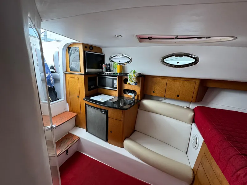 Slide: The Image of Interior of 2008 Donzi 38 ZSF boat with kitchenette and seating area. - 33