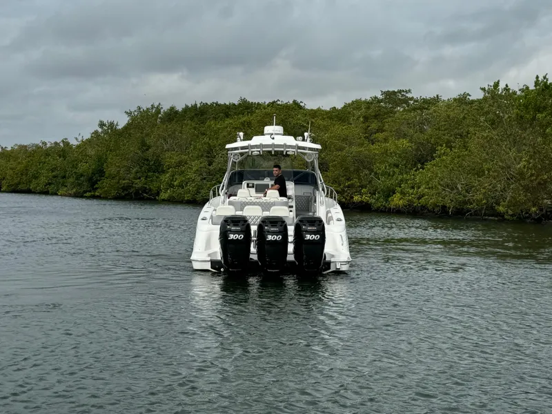 Slide: The Image of 2008 Donzi 38 ZSF boat with four 300 horsepower engines on a calm waterway. - 5