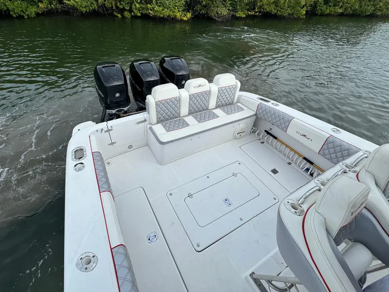 Slide: The Image of 2008 Donzi 38 ZSF boat with triple outboard engines and spacious deck. - 8