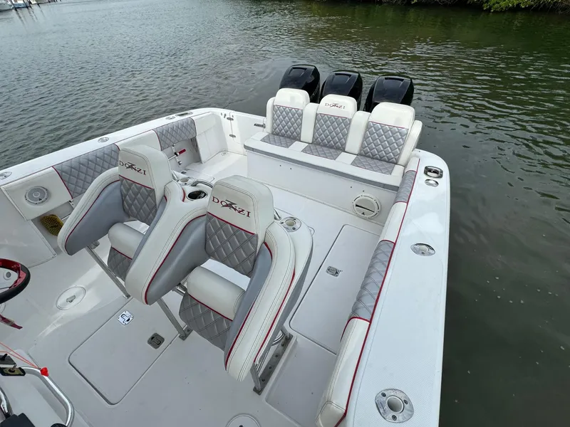 Slide: The Image of 2008 Donzi 38 ZSF boat with triple outboard engines and luxury seating. - 9