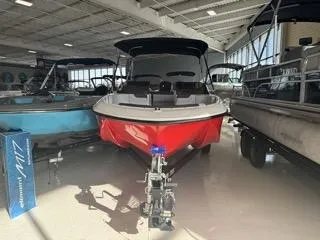 Slide: The Image of 2024 Bayliner Element M19 boat displayed in a showroom. - 3