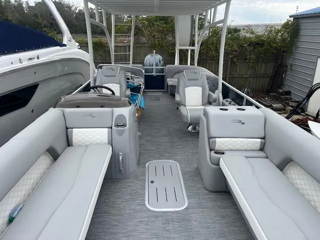 Slide: The Image of 2023 Bennington top deck boat with spacious seating and modern design. - 3