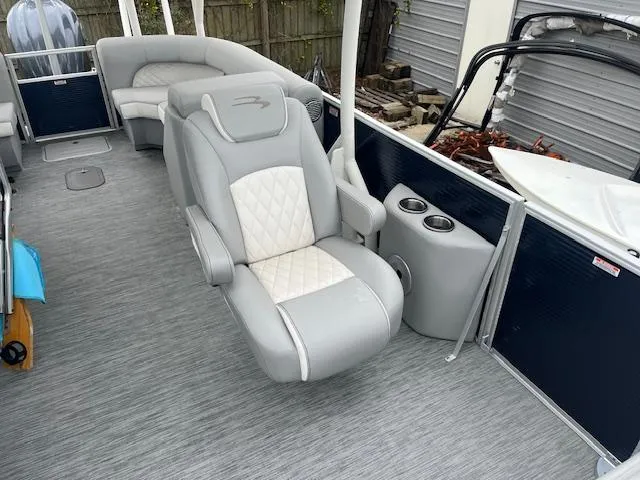 Slide: The Image of 2023 Bennington Top Deck boat interior with luxurious seating and cup holders. - 5