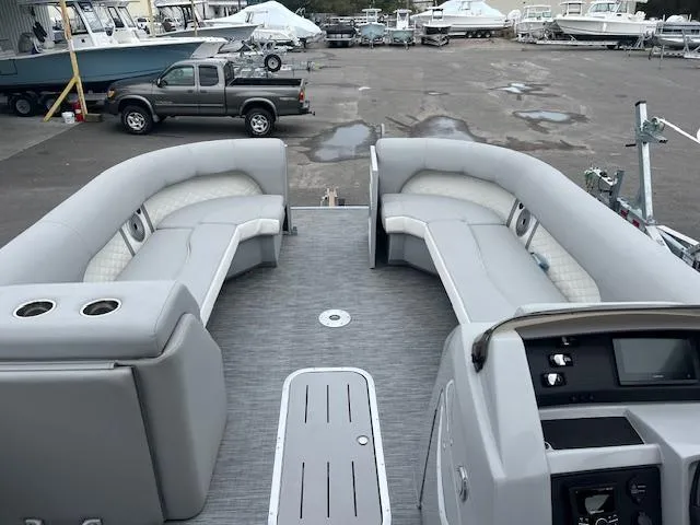 Slide: The Image of 2023 Bennington top deck boat with spacious seating and modern controls. - 6
