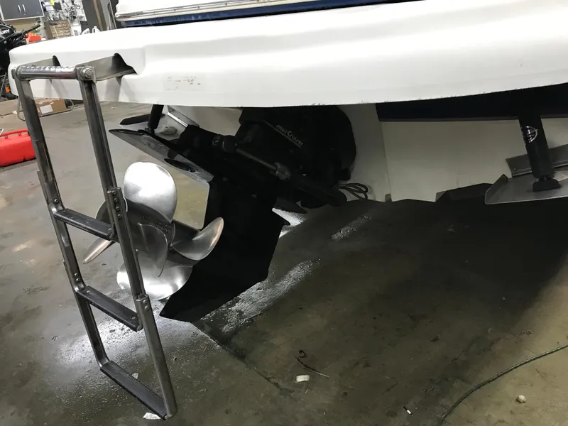 Slide: The Image of 2004 Sea Ray 240 Sundeck stern with propeller and swim ladder. - 9