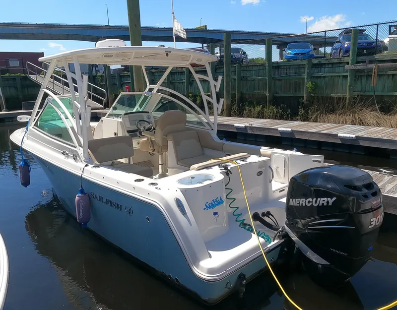 Slide: The Image of 2017 Sailfish 245 DC boat docked with Mercury 300 outboard motor. - 0