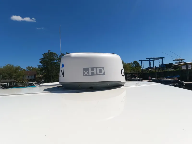 Slide: The Image of Garmin xHD radar on 2017 Sailfish 245 DC boat under clear blue sky. - 15