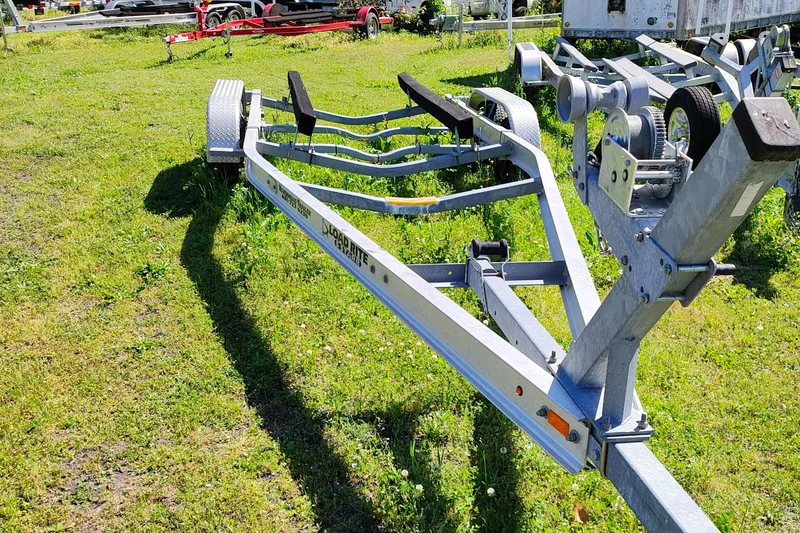Slide: The Image of Boat trailer for 2017 Sailfish 245 DC on grassy lot. - 20