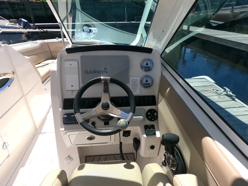 Slide: The Image of 2017 Sailfish 245 DC boat helm with Garmin navigation system. - 5