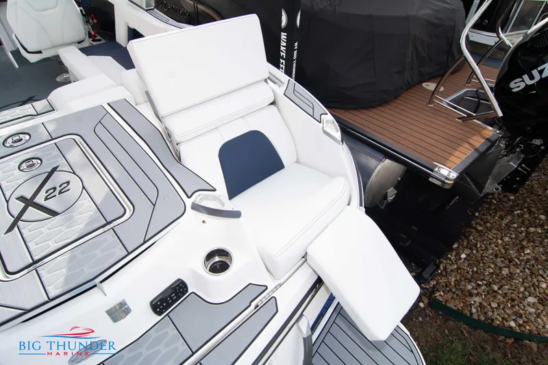 Slide: The Image of 2024 MasterCraft X22 boat with luxurious seating and modern design. - 10