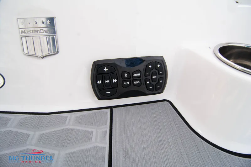 Slide: The Image of 2024 MasterCraft X22 boat control panel and logo on deck. - 12