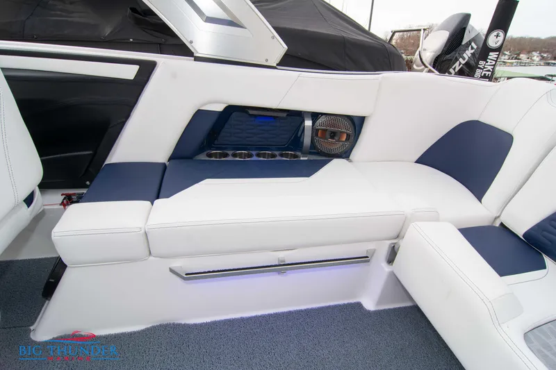 Slide: The Image of 2024 MasterCraft X22 boat interior with white and blue seating. - 17