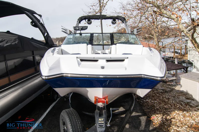 Slide: The Image of 2024 MasterCraft X22 boat on trailer, front view, displayed at Big Thunder Marine. - 2