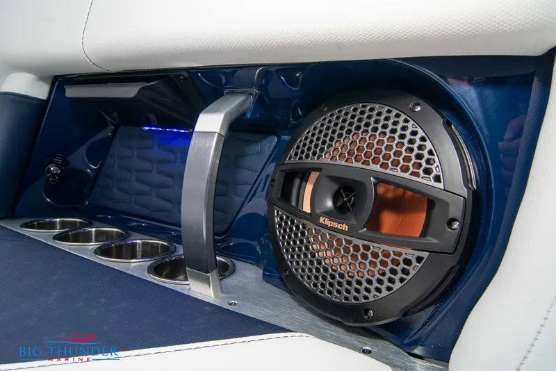 Slide: The Image of 2024 MasterCraft X22 boat interior with Klipsch speaker and cup holders. - 20
