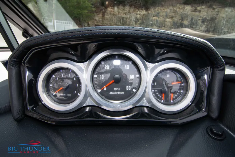 Slide: The Image of 2024 MasterCraft X22 boat dashboard with speedometer and gauges. - 29