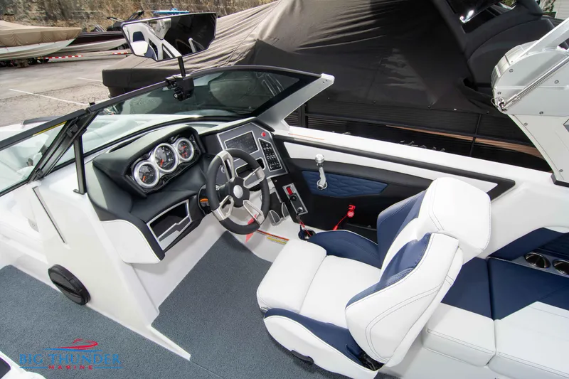 Slide: The Image of 2024 MasterCraft X22 boat interior with modern dashboard and comfortable seating. - 34