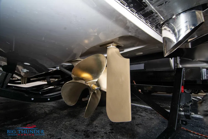 Slide: The Image of Close-up of the propeller and rudder of a 2024 MasterCraft X22 boat. - 6