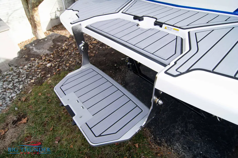 Slide: The Image of 2024 MasterCraft X22 boat swim platform with fold-down step. - 8