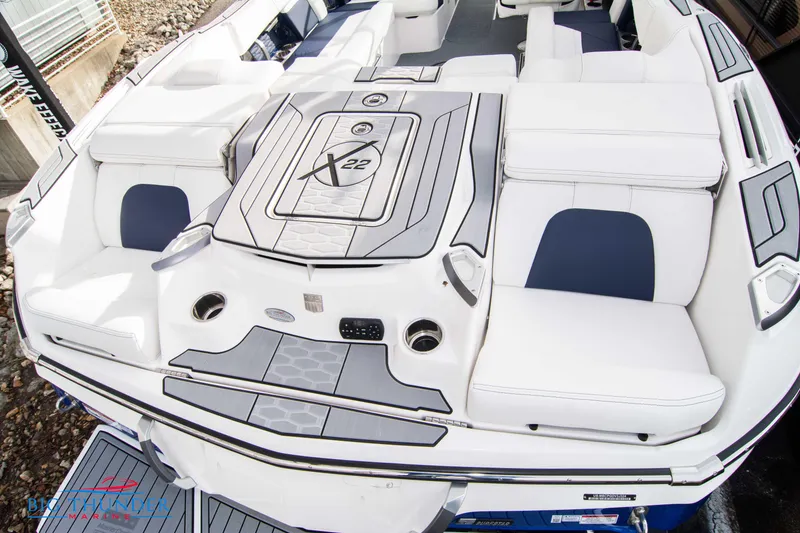 Slide: The Image of 2024 MasterCraft X22 boat with luxurious seating and modern design. - 9
