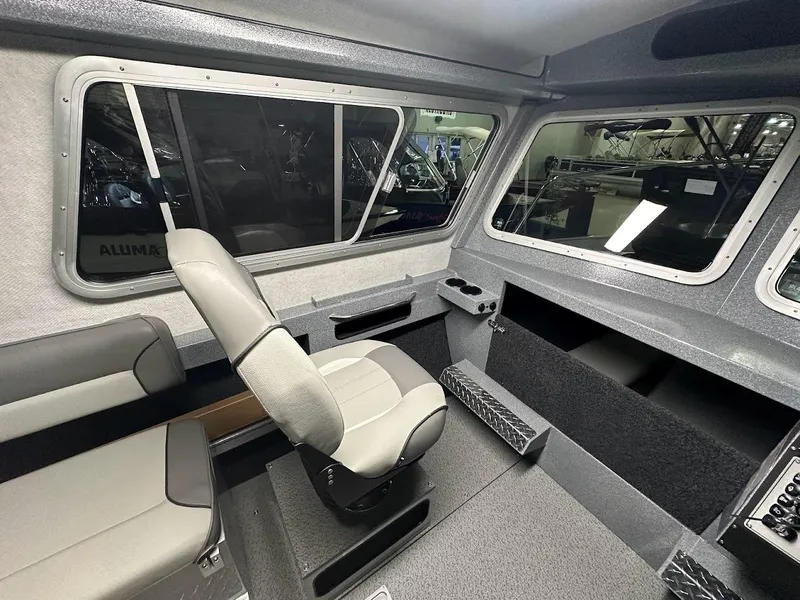 Slide: The Image of Interior of 2024 KingFisher 2325 Coastal Express boat with seating and windows. - 16