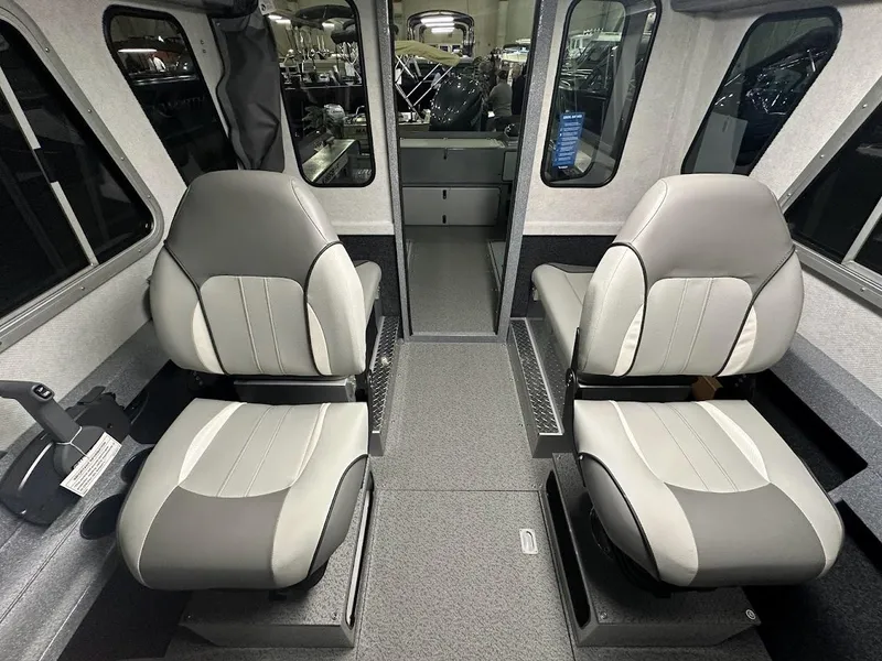 Slide: The Image of 2024 KingFisher 2325 Coastal Express interior with two grey captain's chairs. - 19
