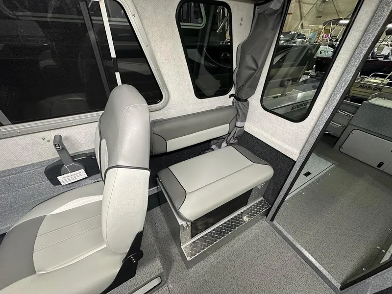 Slide: The Image of 2024 KingFisher 2325 Coastal Express interior seating and cabin view. - 20