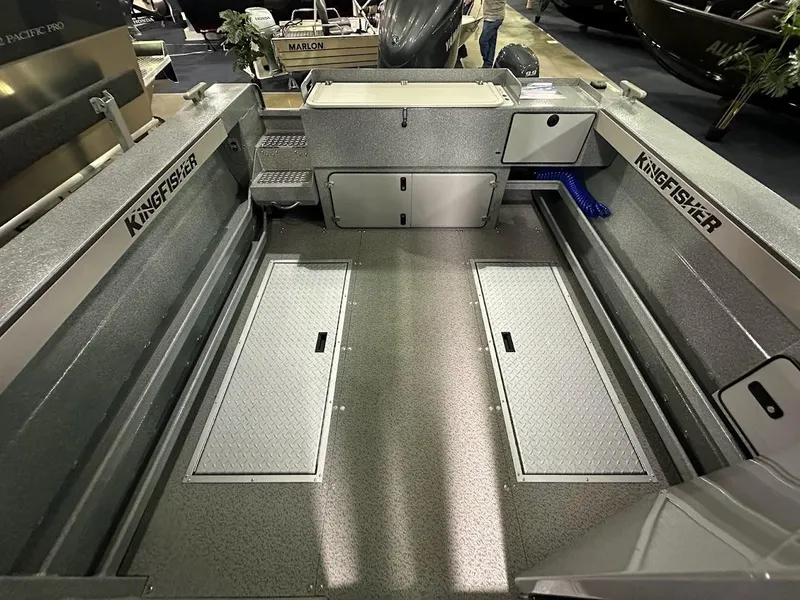 Slide: The Image of 2024 KingFisher 2325 Coastal Express boat interior with storage compartments. - 24