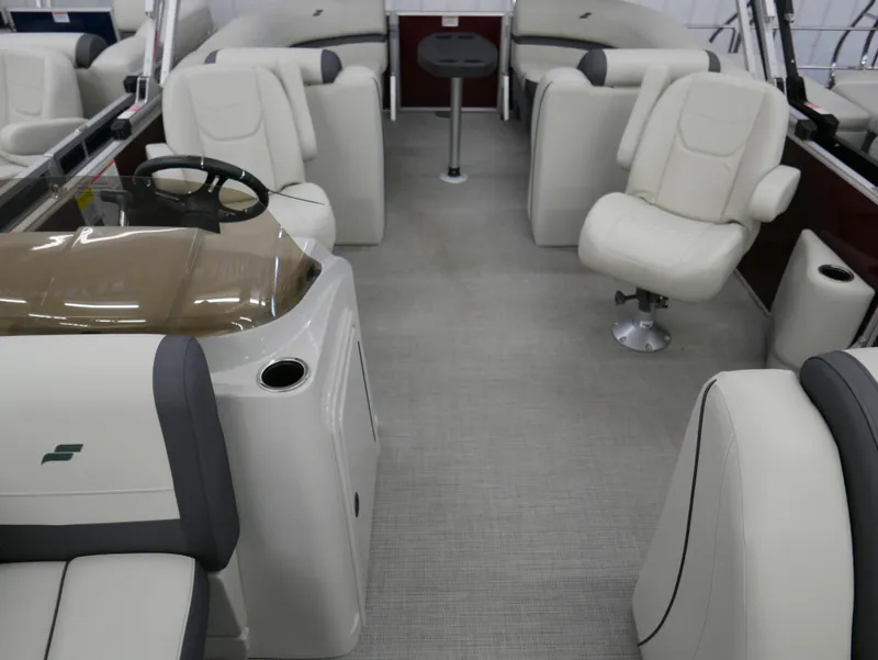 Slide: The Image of 2024 Starcraft EX 22 R boat interior with plush seating and modern helm. - 10