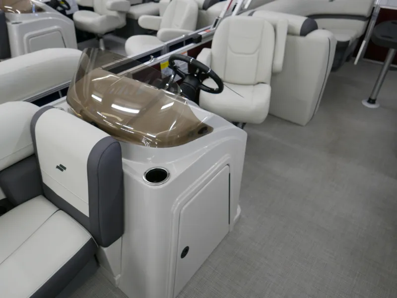 Slide: The Image of 2024 Starcraft EX 22 R boat interior with modern seating and steering console. - 12