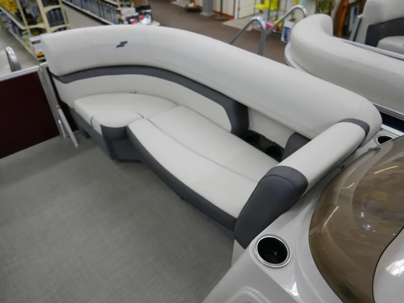 Slide: The Image of 2024 Starcraft EX 22 R boat interior with sleek white and gray seating. - 5