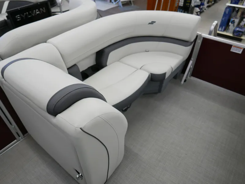 Slide: The Image of 2024 Starcraft EX 22 R boat interior with white and gray seating. - 6