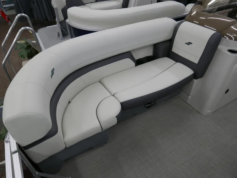 Slide: The Image of 2024 Starcraft EX 22 R boat interior with plush white seating. - 9