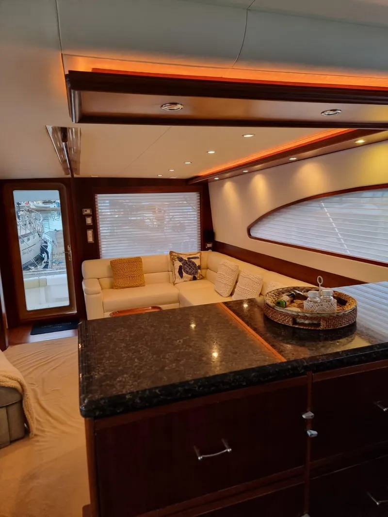 Slide: The Image of Luxurious interior of 2009 Bertram 700 Enclosed yacht with modern furnishings and ambient lighting. - 11