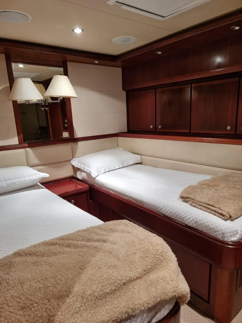 Slide: The Image of Luxurious twin cabin interior of a 2009 Bertram 700 Enclosed yacht. - 17