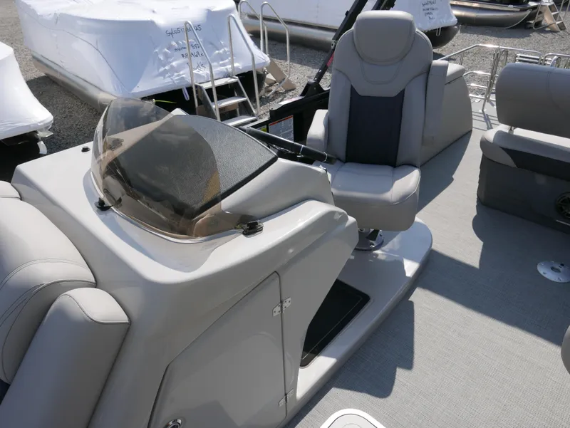 Slide: The Image of 2024 Starcraft SLS 3 Q DH boat interior with sleek helm and comfortable seating. - 12