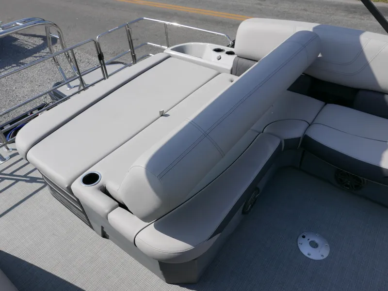 Slide: The Image of 2024 Starcraft SLS 3 Q DH boat interior with plush seating and cup holders. - 18