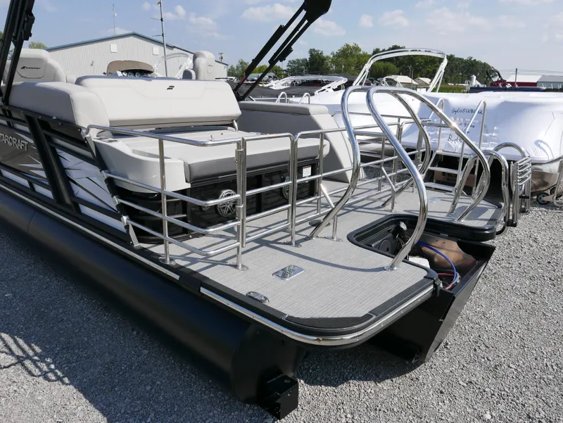 Slide: The Image of 2024 Starcraft SLS 3 Q DH pontoon boat with sleek design and spacious seating. - 3