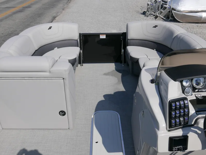Slide: The Image of 2024 Starcraft SLS 3 Q DH boat interior with plush seating and modern dashboard. - 5