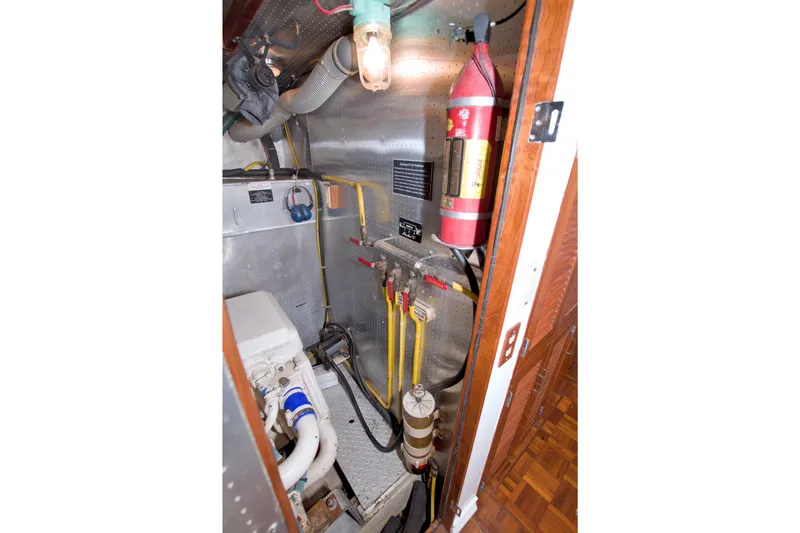 Slide: The Image of Engine room of 1994 Jefferson Marquessa 56 Extended Deckhouse with fire extinguisher and equipment. - 108