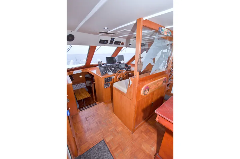 Slide: The Image of 1994 Jefferson Marquessa 56 yacht helm with wooden interior and navigation equipment. - 51