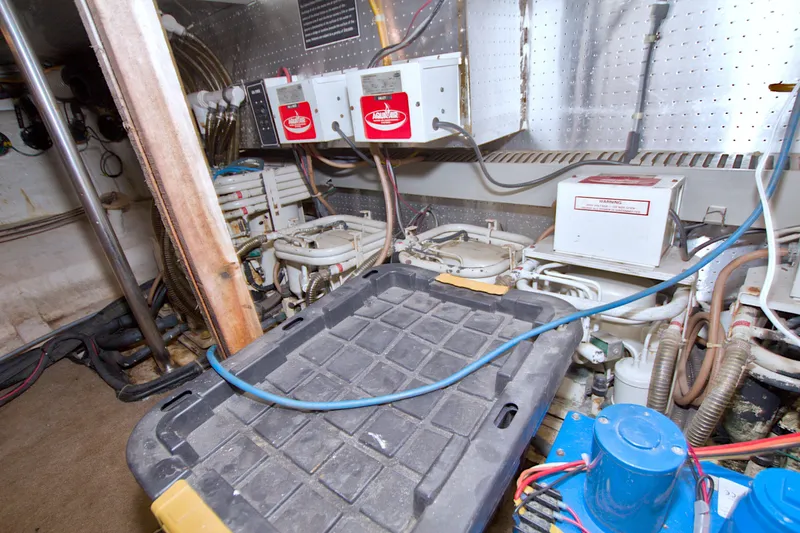 Slide: The Image of Engine room of 1994 Jefferson Marquessa 56 yacht, featuring mechanical equipment and wiring. - 127