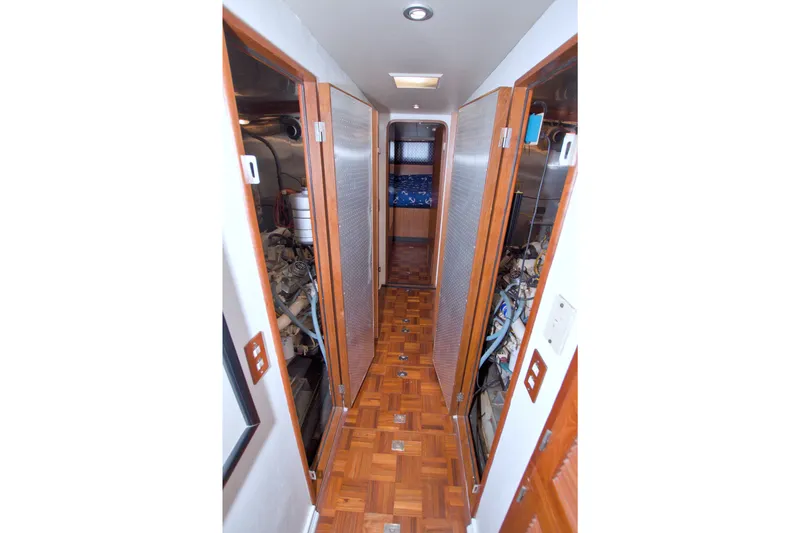 Slide: The Image of Narrow hallway inside 1994 Jefferson Marquessa 56 Extended Deckhouse yacht with wooden flooring. - 109