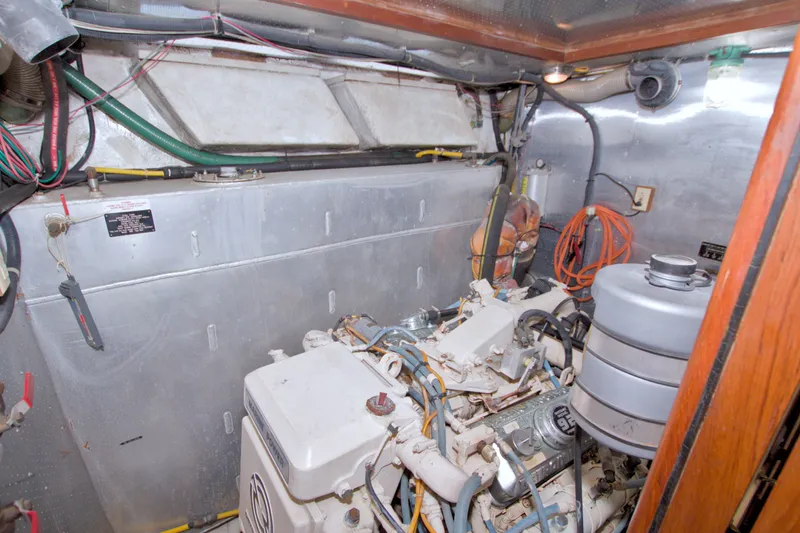 Slide: The Image of Engine room of 1994 Jefferson Marquessa 56 Extended Deckhouse yacht, showcasing machinery and wiring. - 113