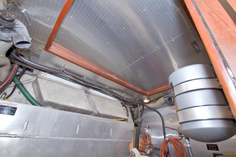 Slide: The Image of Engine room of 1994 Jefferson Marquessa 56 Extended Deckhouse yacht, showcasing mechanical components. - 114