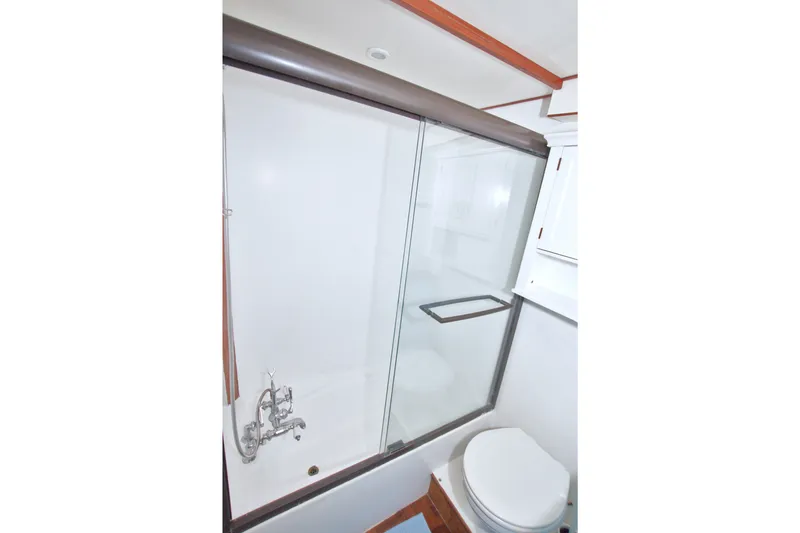 Slide: The Image of Bathroom interior of 1994 Jefferson Marquessa 56 yacht, featuring shower and toilet. - 96
