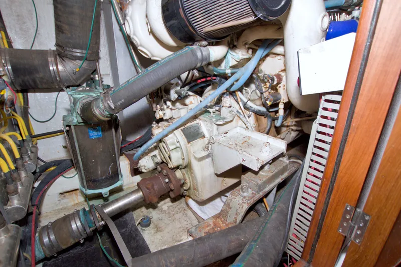 Slide: The Image of Engine room of a 1994 Jefferson Marquessa 56 Extended Deckhouse yacht, showcasing mechanical components. - 101