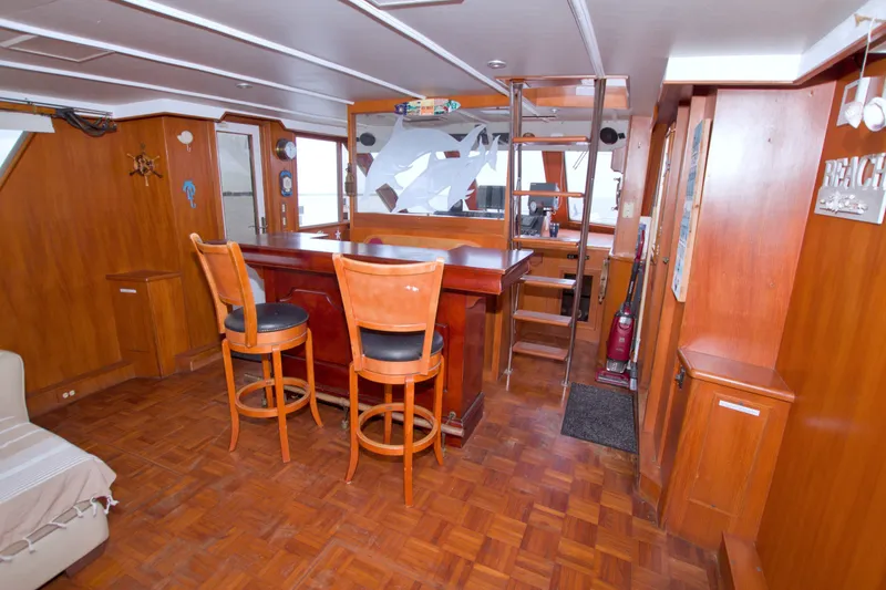 Slide: The Image of Interior of 1994 Jefferson Marquessa 56 yacht with wooden bar and seating area. - 26