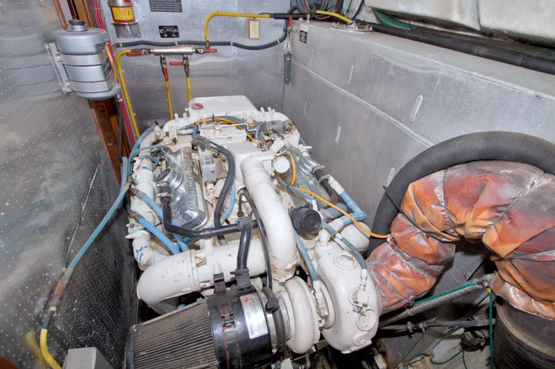 Slide: The Image of Engine room of a 1994 Jefferson Marquessa 56 Extended Deckhouse yacht, showcasing mechanical components. - 117